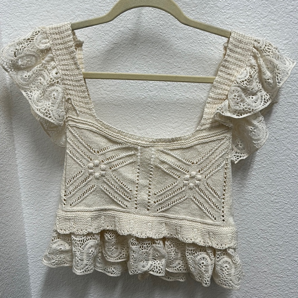Never worn ruffle sleeve knit cropped tank. Perfect for beach vacations.